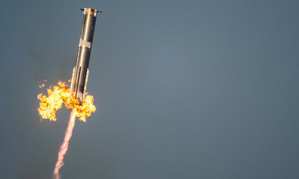 BOCA CHICA BEACH, TEXAS - MARCH 06: The SpaceX Starship Flight 8 booster returns returns from its ascent at Boca Chica beach on March 06, 2025 in Boca Chica Beach, Texas. The SpaceX Starship Flight 8 test launched and successfully caught its booster upon descent.