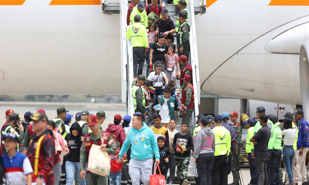 Venezuelan migrants walk down a plane upon arrival at Simon Bolivar International Airport in Maiquetia, Venezuela on March 20, 2025. Venezuela on Thursday flew home a planeful of its citizens from Mexico, most of them US-bound migrants whose journey came to a premature end as Washington cracks down on undocumented foreigners.